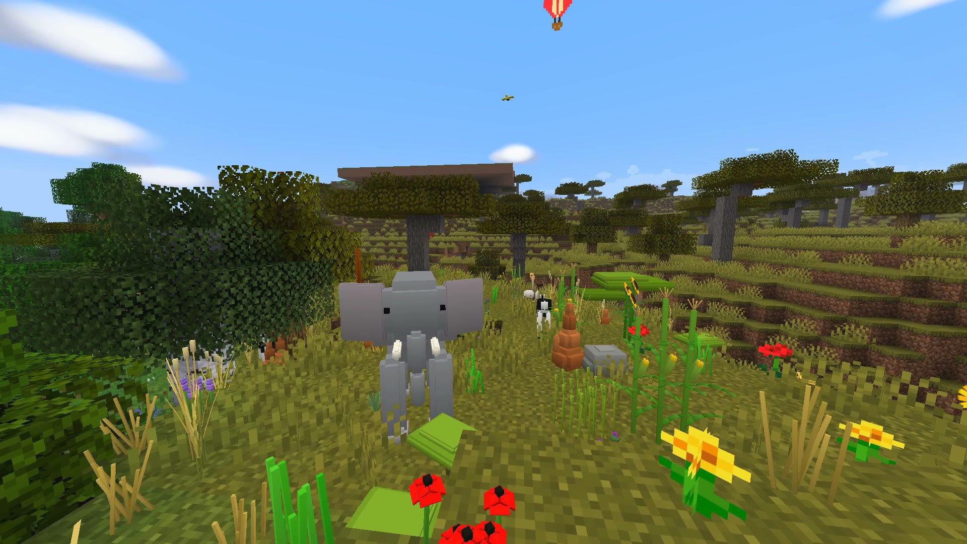 Savanna with an elephant and flowers